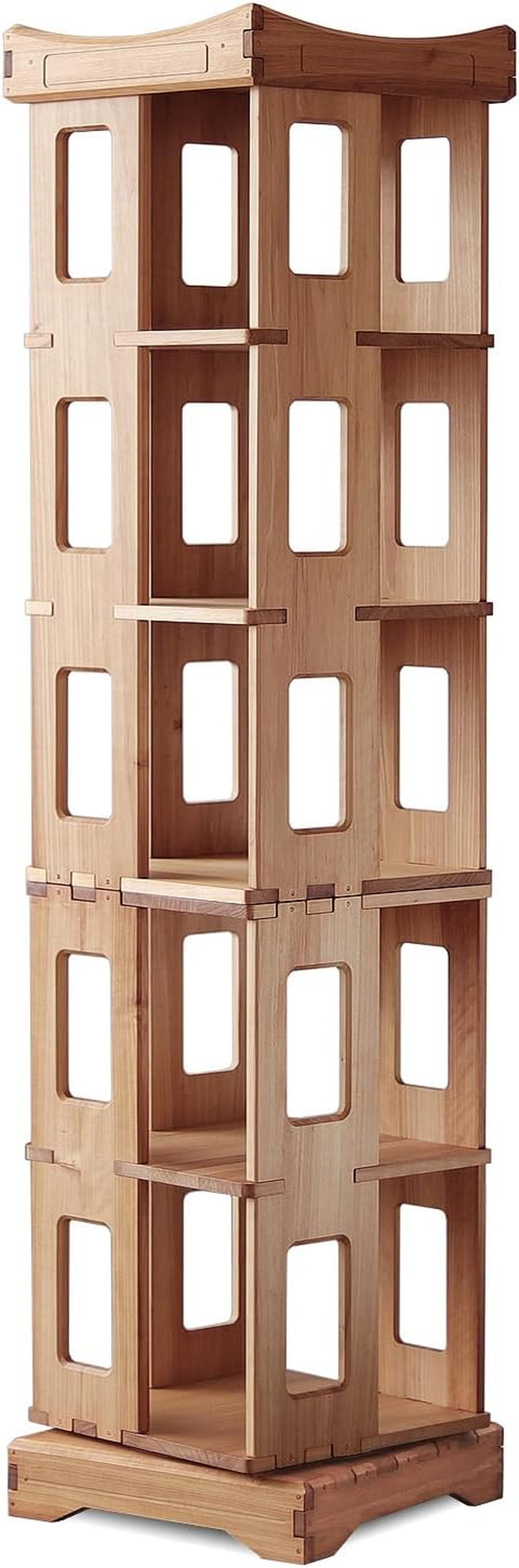 Bookshelf shown holding books, magazines, and small plants on each tier