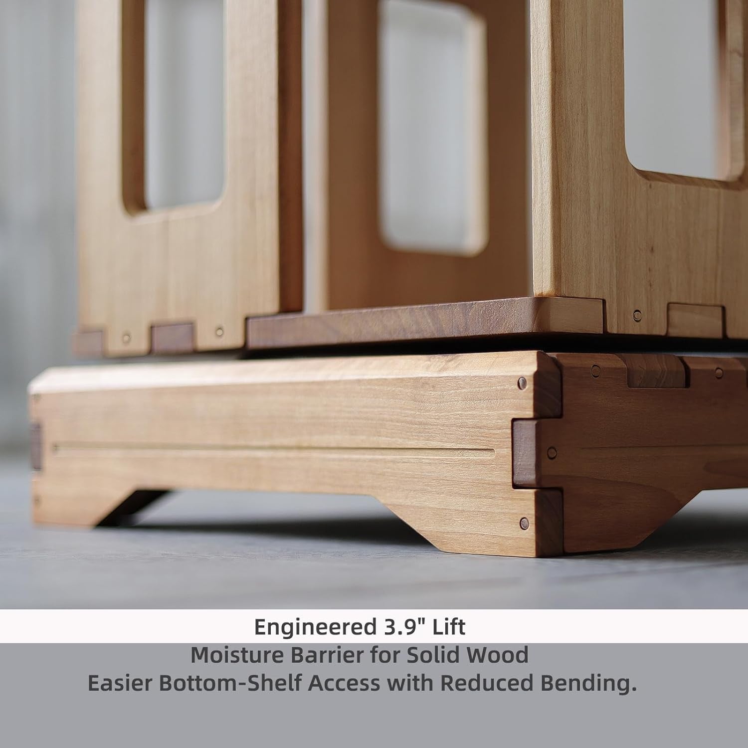 Rotating corner bookshelf styled in a living room corner with books and decor