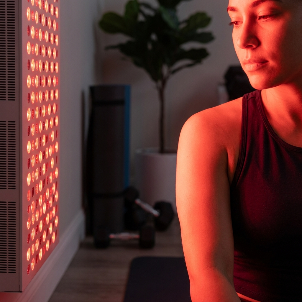Radiant Full-Body Red Light Panel in use, person standing close with red light on skin
